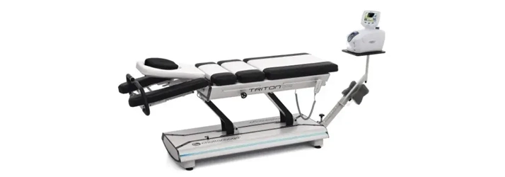 A black and white spinal decompression table.