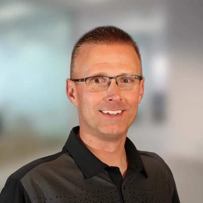 A headshot of Dr. Lamar C. Fox, a chiropractor at Huxford Chiropractic Clinic.